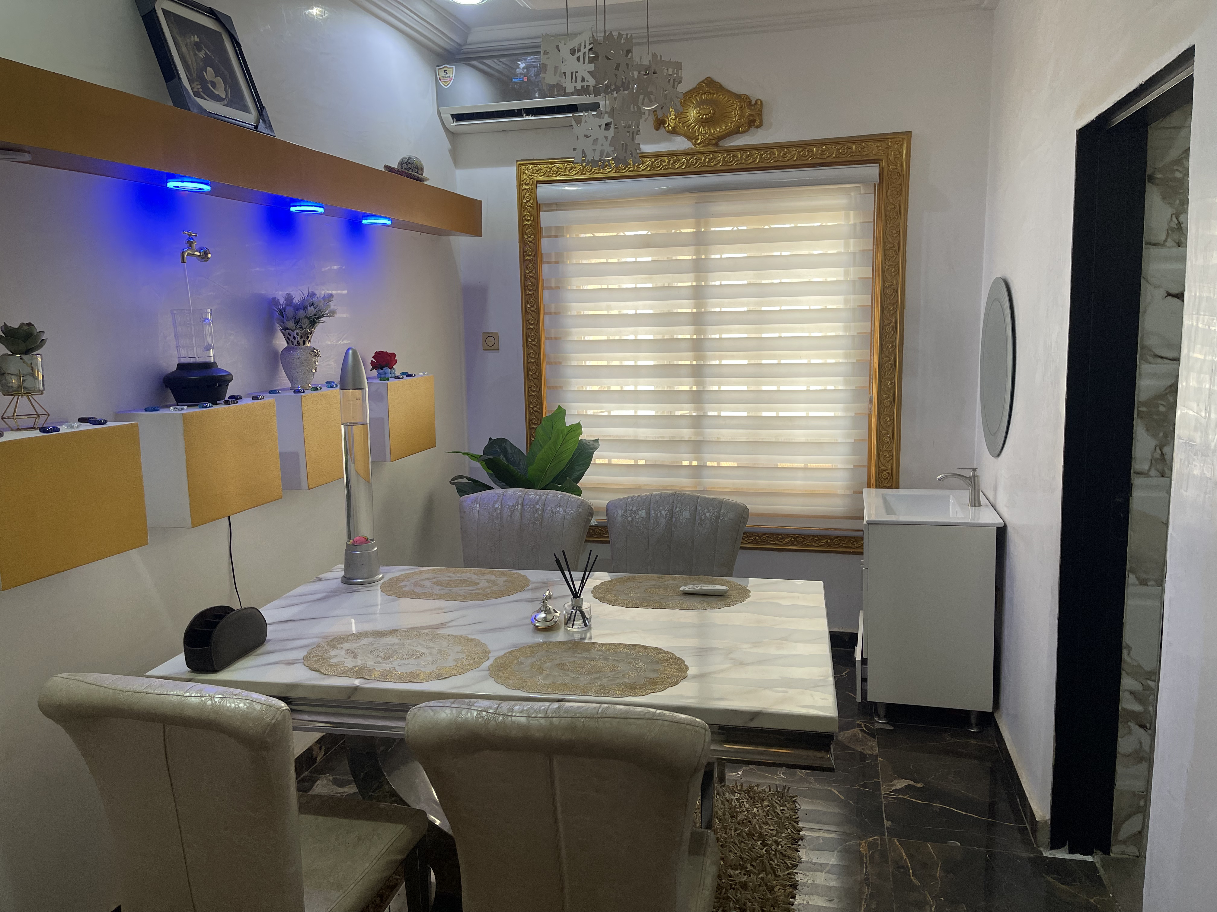 Modern dining area with marble table and sophisticated lighting